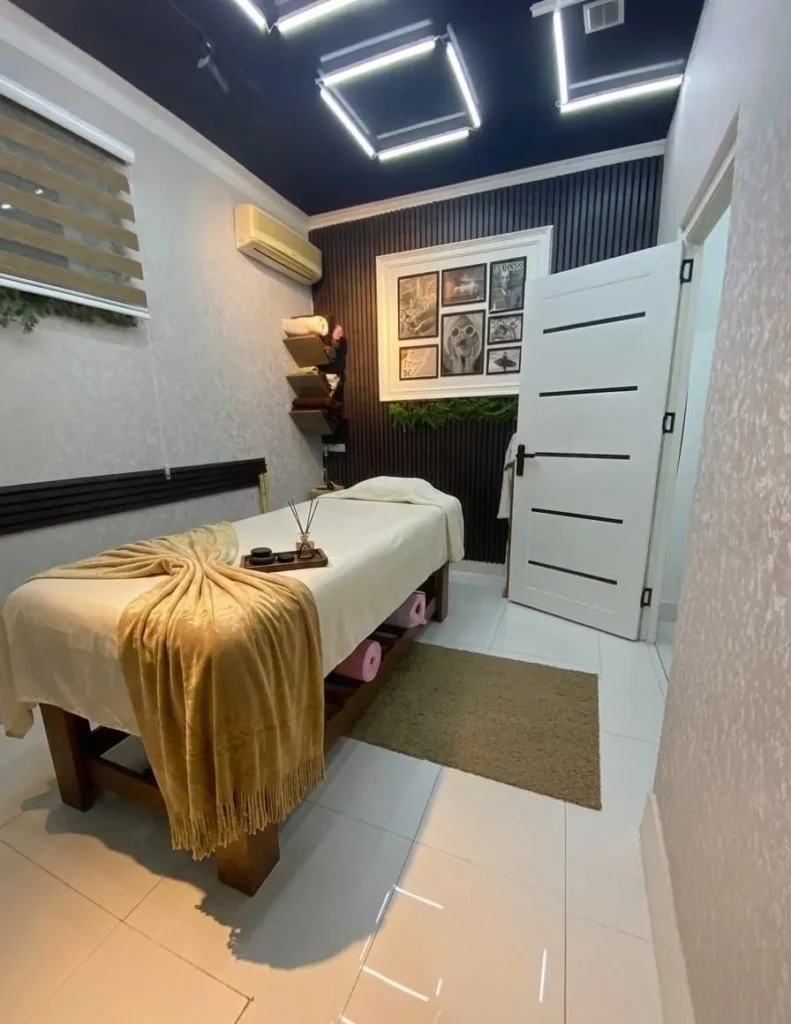 Treatment room with gold linen at The Port Baku Spa